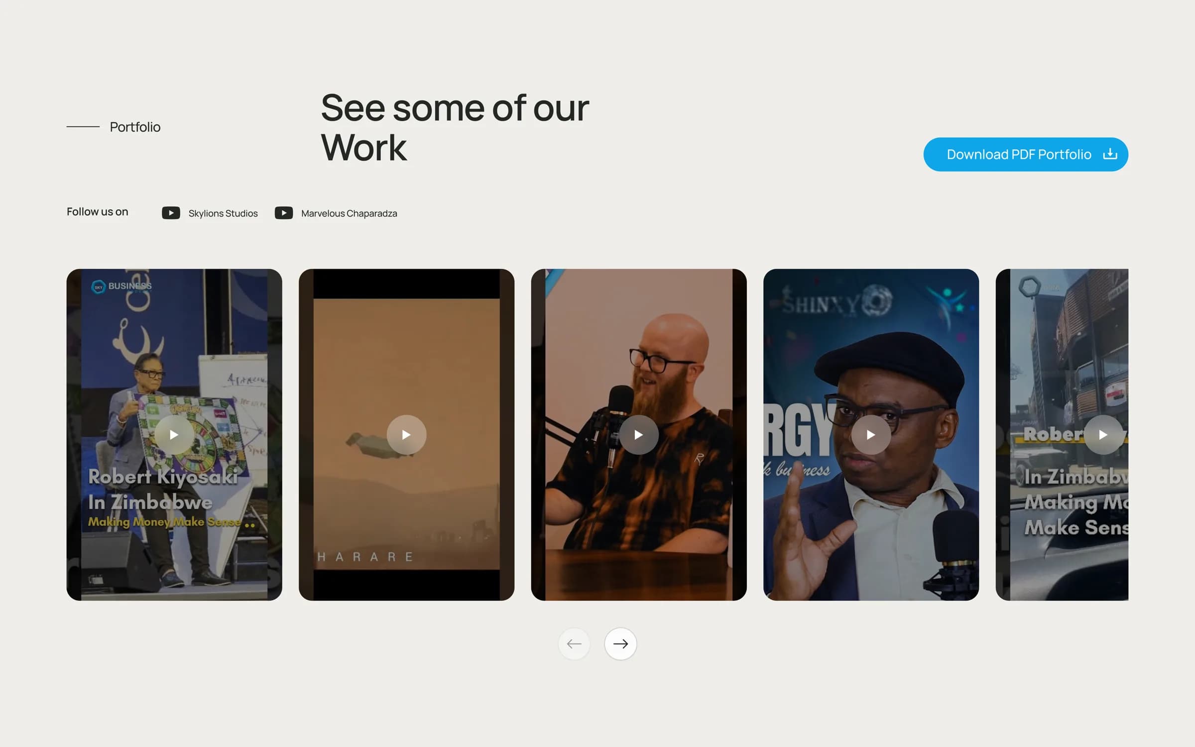 The portfolio section of the Skylions Studios site, showing a horizontal carousel of video thumbnails with play controls.
